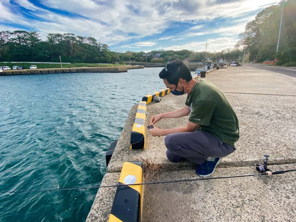 Todd prepares fishing line on Ojika Island