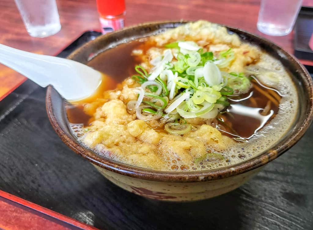 A bowl of tempura-topped soba at Futaba Shokudo.