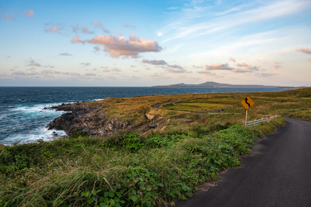 Empty road and wild natural coastlines of Ojika Island