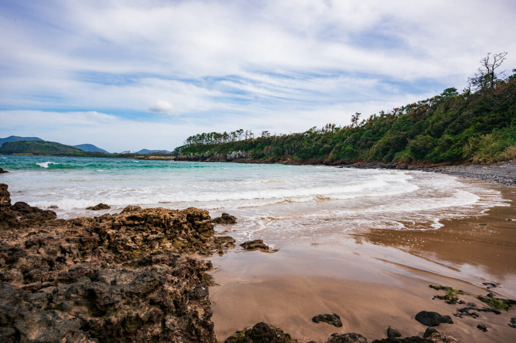 Kakinohama Beach is known for its translucent blue waters and coral that grows a reasonable distance from its shores, on Ojika