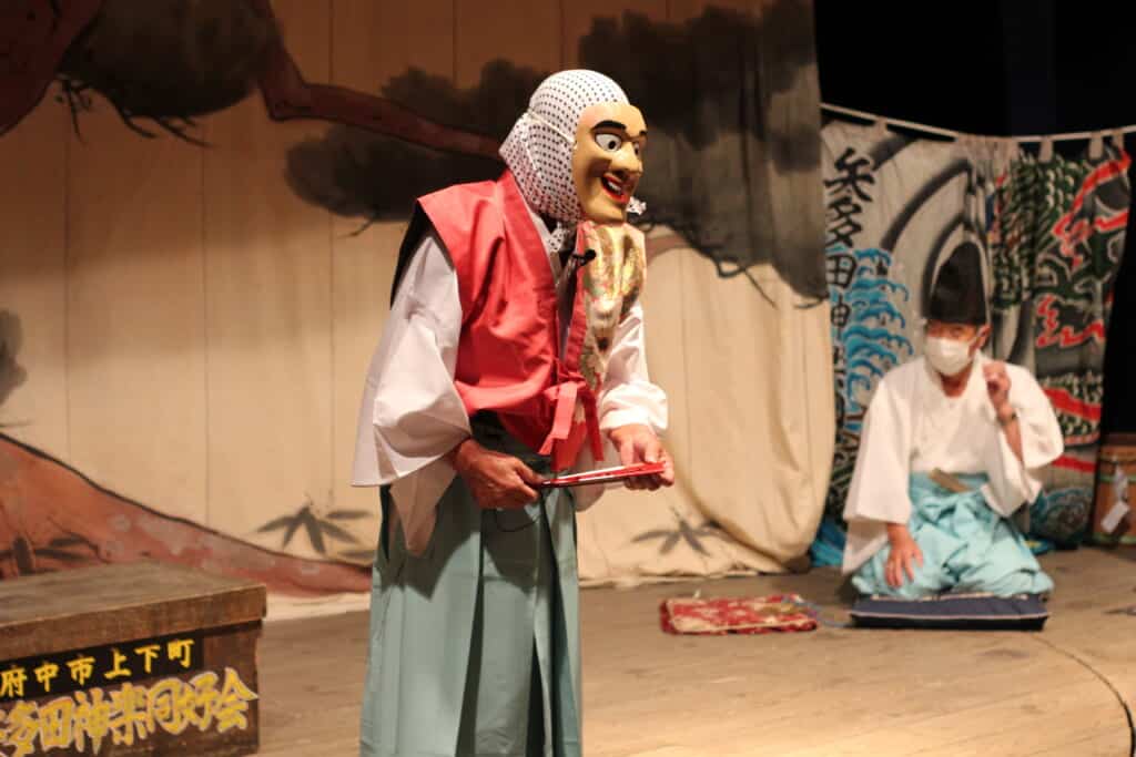 Actor wearing a mask during a kagura performance in Joge, Hiroshima Prefecture