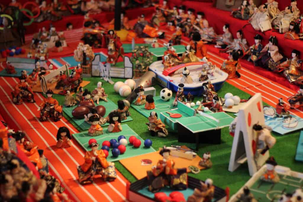 A minitature Olympic stadium, created with antique Japanese dolls