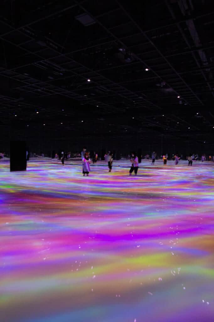 colored lines projected on the water at teamLab Planets in Tokyo
