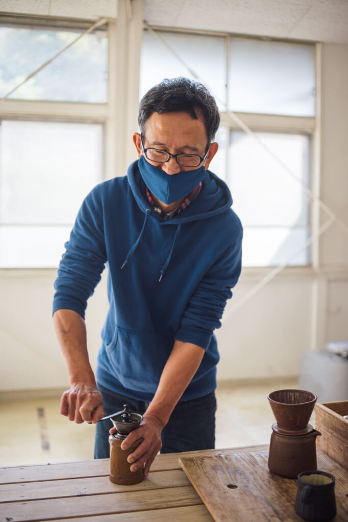 grinding coffee for traditional japanese ceramics