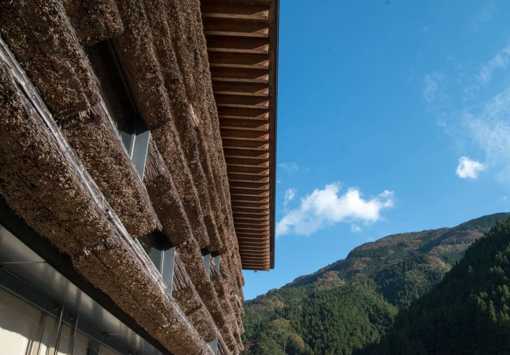 Detail of Kengo Kuma's Yusuhara Machino-eki, with thatched roof detailing in Yusuhara Town, Shikoku.