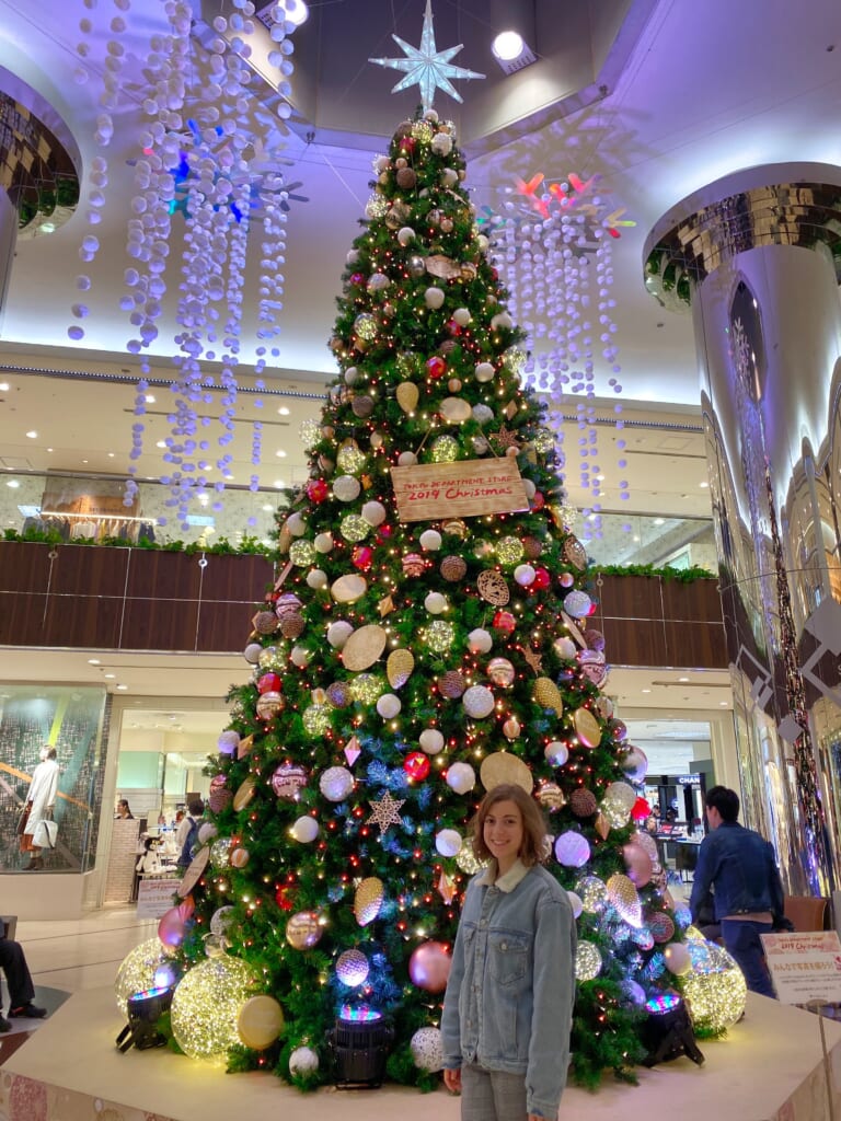 Maria in front of a Christmas tree