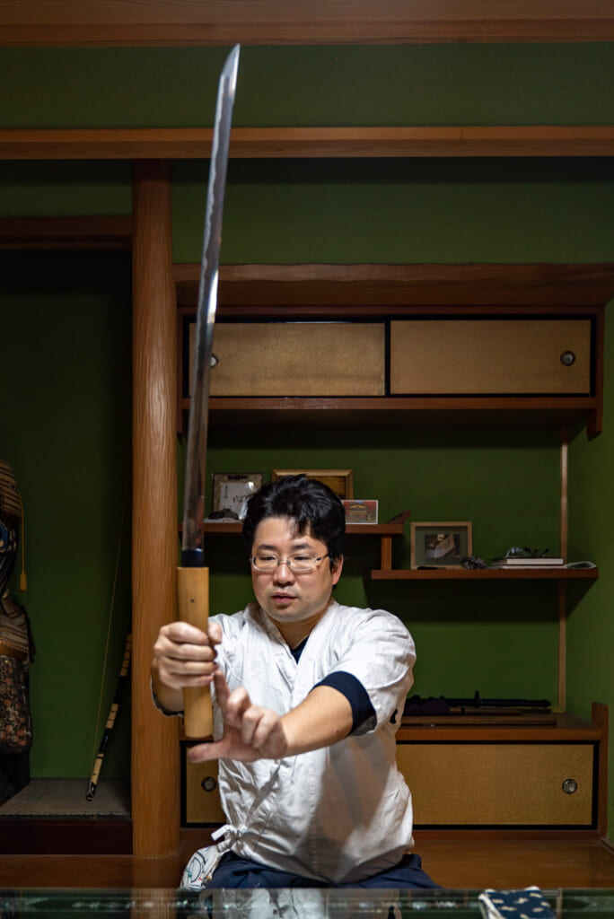 man with japanese samurai sword