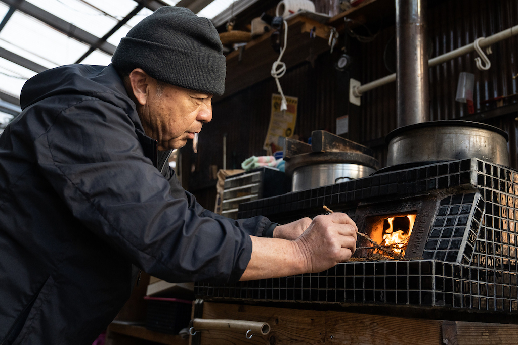 Mr. Ogura kindles the furnace