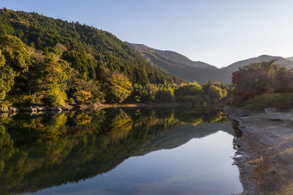 Green mountains reflected in clear water in mie prefecture