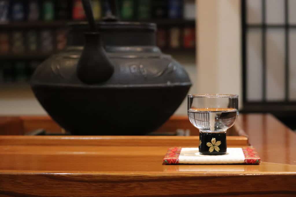 glass of Japanese sake in tatami shop in Japan