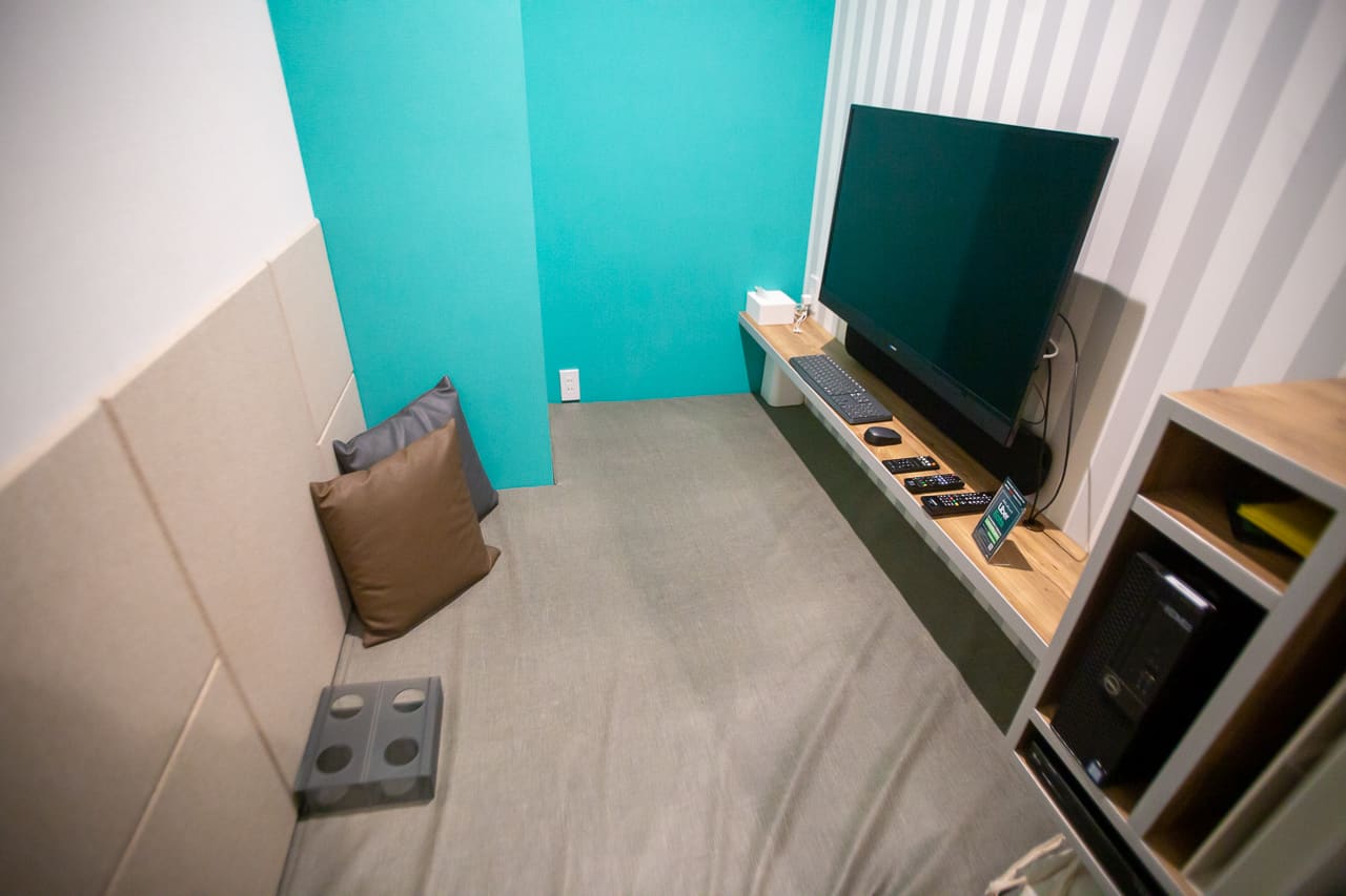 Some private rooms include a computer with a screen and a movie player.