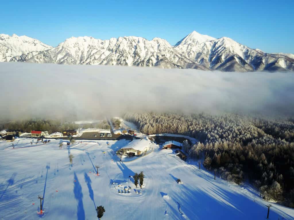 mountains with a band of cloud in front