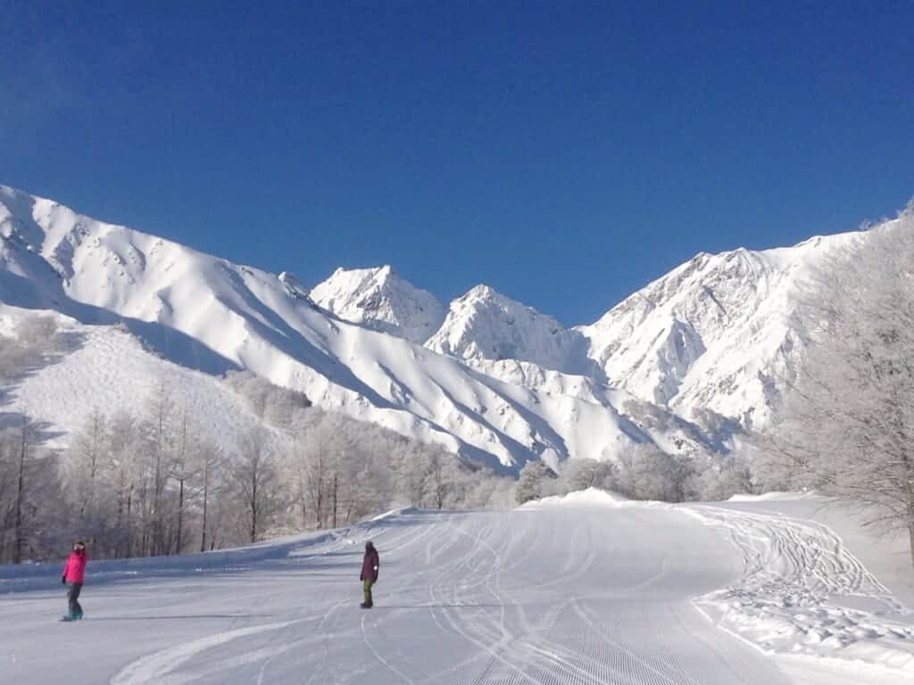 snow covered mountains against blue sky