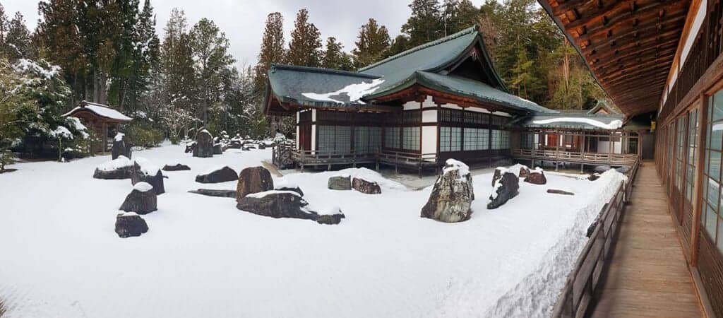 Wide view of Kongobu-ji temple in a snowy rock garden