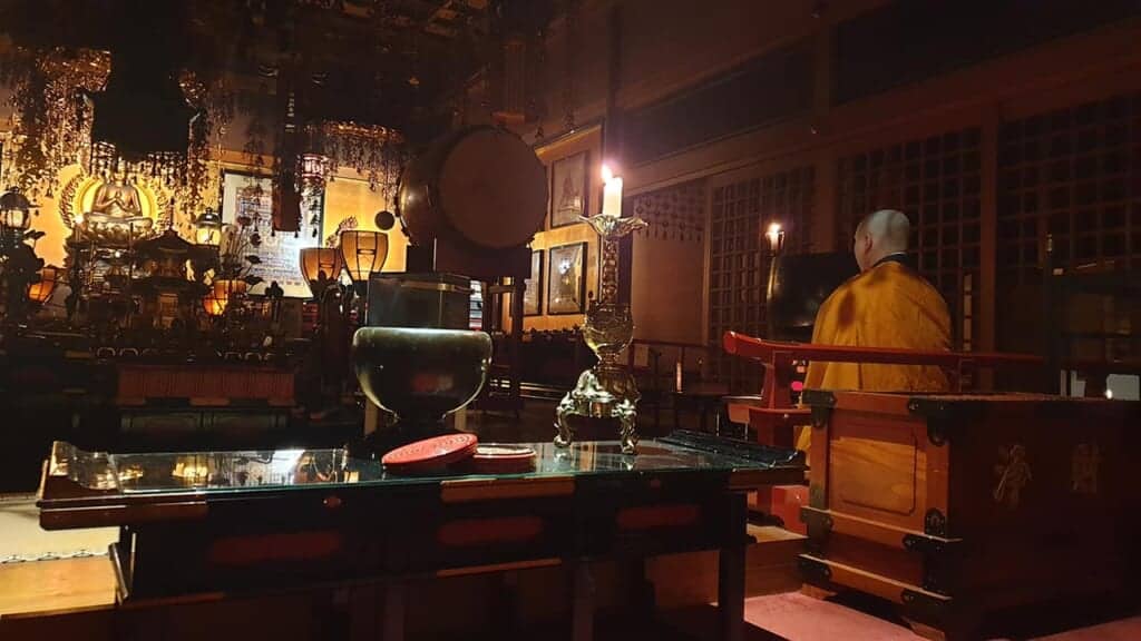 Morning prayer in a Japanese Buddhist temple in Koyasan