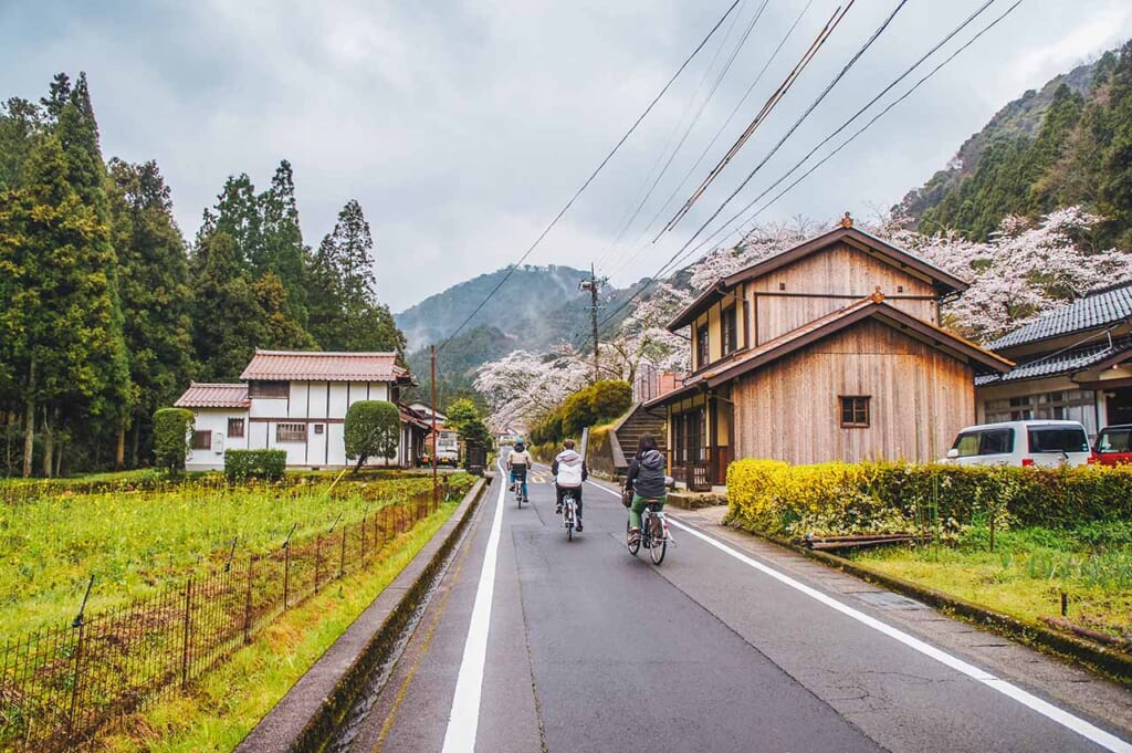 cycling in Japan on bicycles through rural streets of the Japanese countryside