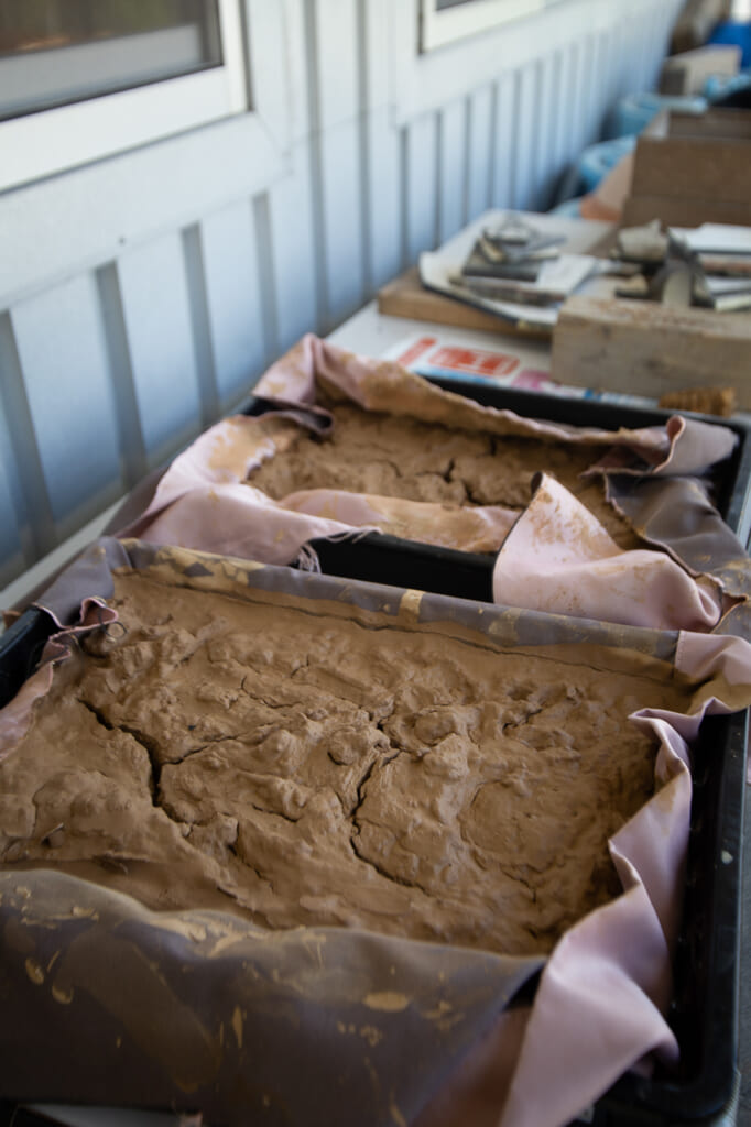 red clay is used to create japanese pottery