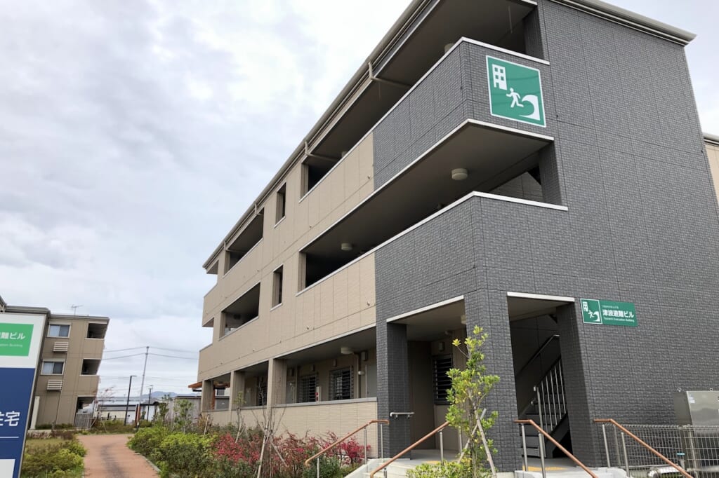 tsunami evacuation sign on building in Japan