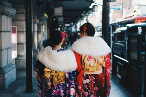 Two girls dressing the Seijin Shiki kimono in Japan