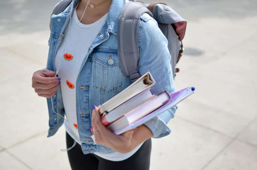 woman carrying books