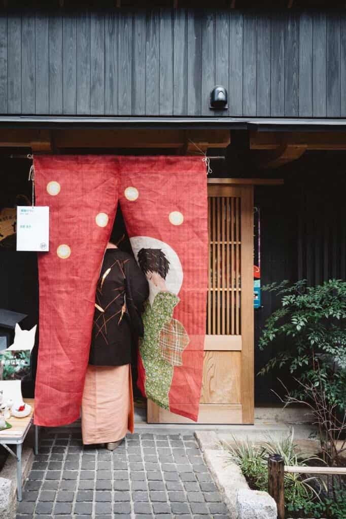 noren with kimono woman in Japan