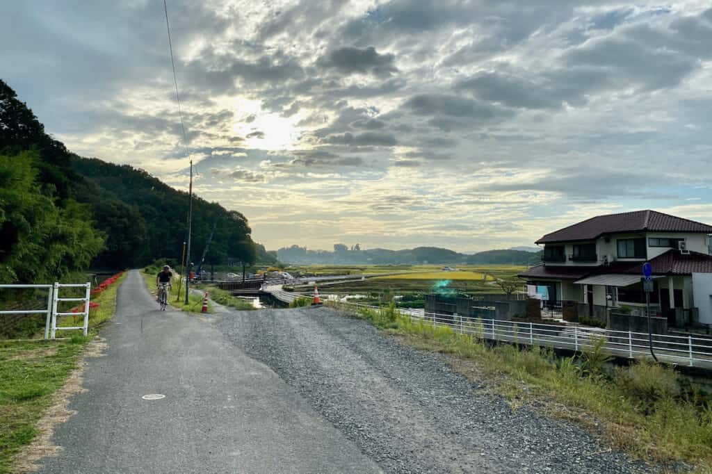 cyclist on rural bike path of Kibiji cycling route in Japan