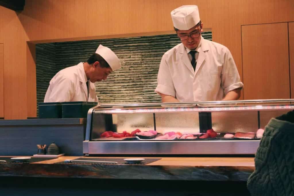 chefs preparing sashimi, Japan