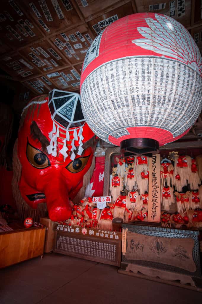 giant tengu masks at a temple in Japan