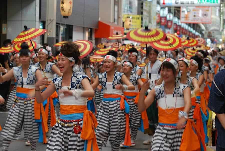 group of people dancing during the festival in Japan