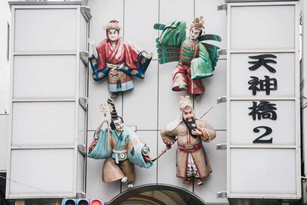 kabuki ornaments in one of the tenjinbashisuji entrances in osaka shopping street