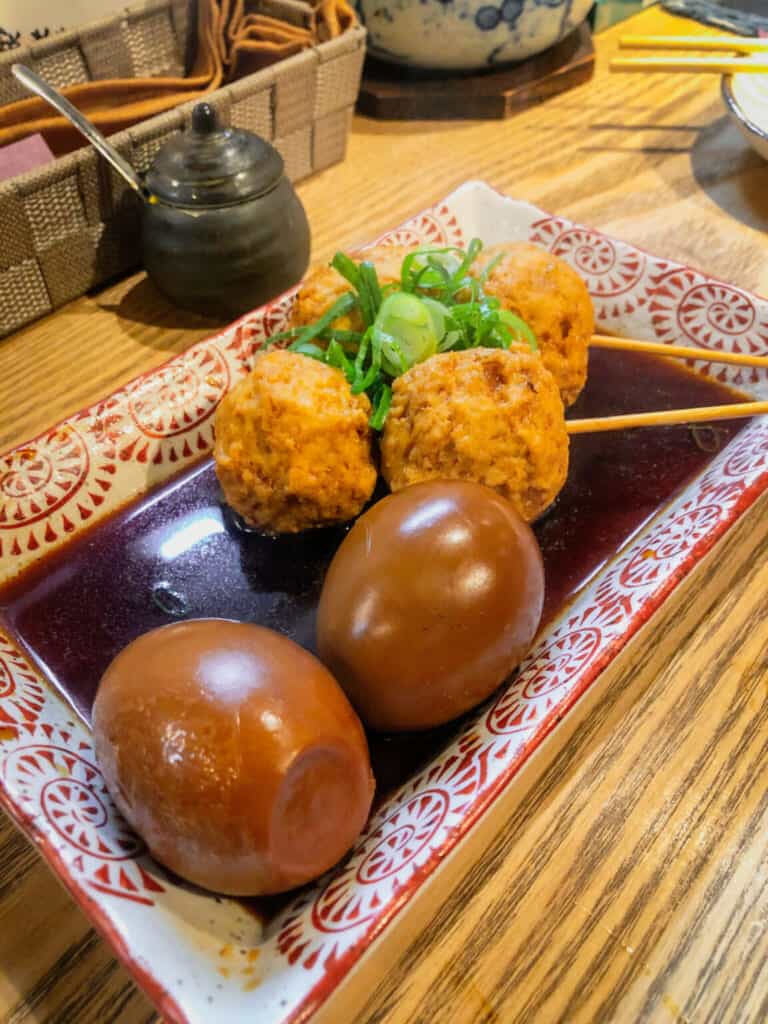 detail of boiled eggs and niku-dango