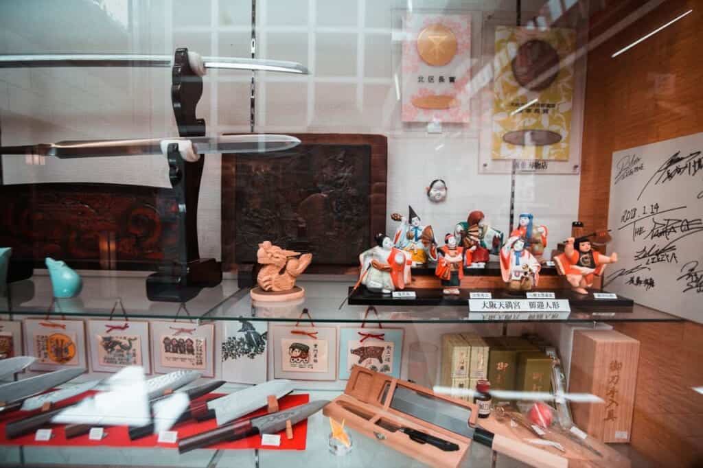 showcase with katanas and knives in Tenjinbashisuji shopping street in osaka