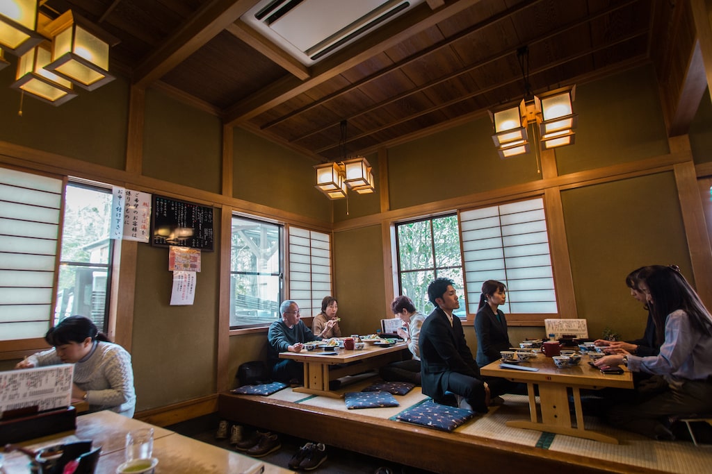 people sitting at the low tables in Yusui restaurant 