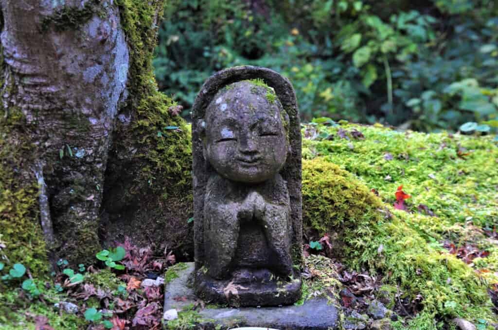 stone jizo statue in kyoto, japan