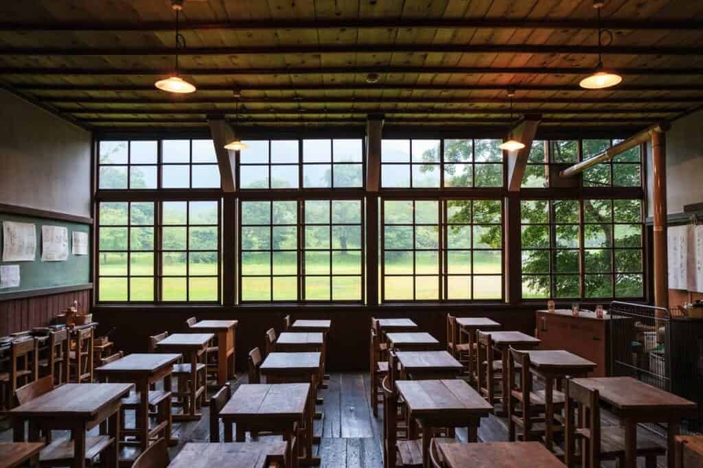 Classroom of a former rural Japanese school, with wooden desks and chairs