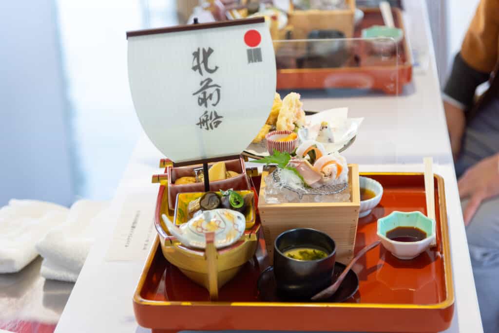 traditional japanese cuisine with miniature boat
