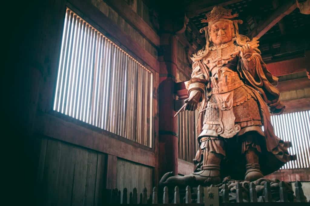 statue protecting the great buddha of nara, japan