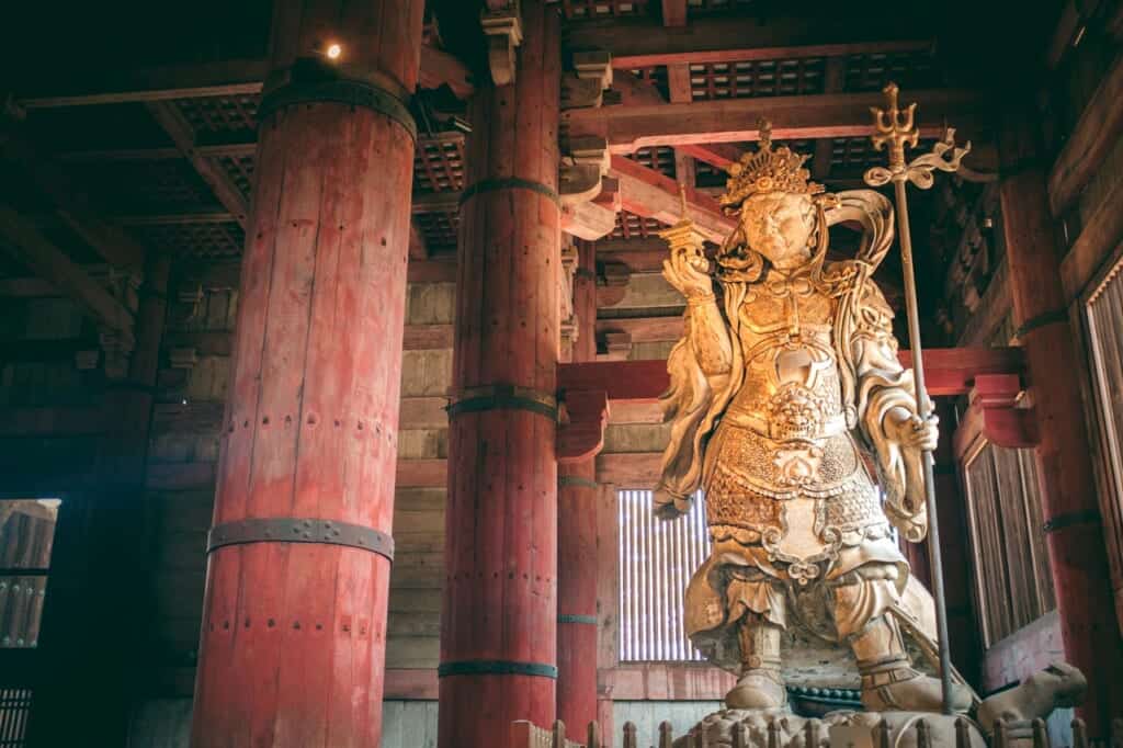 one of the massive statues of the daibutsu-den in Nara Park, japan