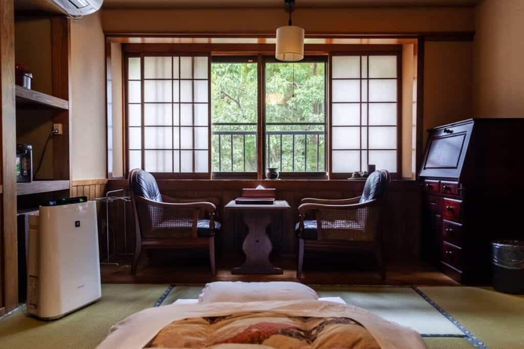 traditional Japanese style inn room with futon and tatami