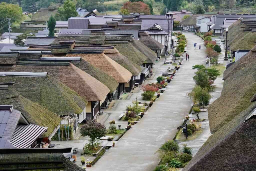 row of Japanese thatched roof houses in Ouchi-juku