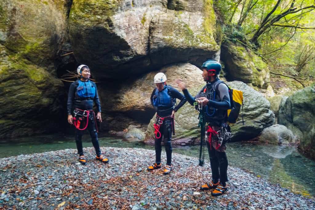 people preparing for canyoning adventure travel in shikoku, japan