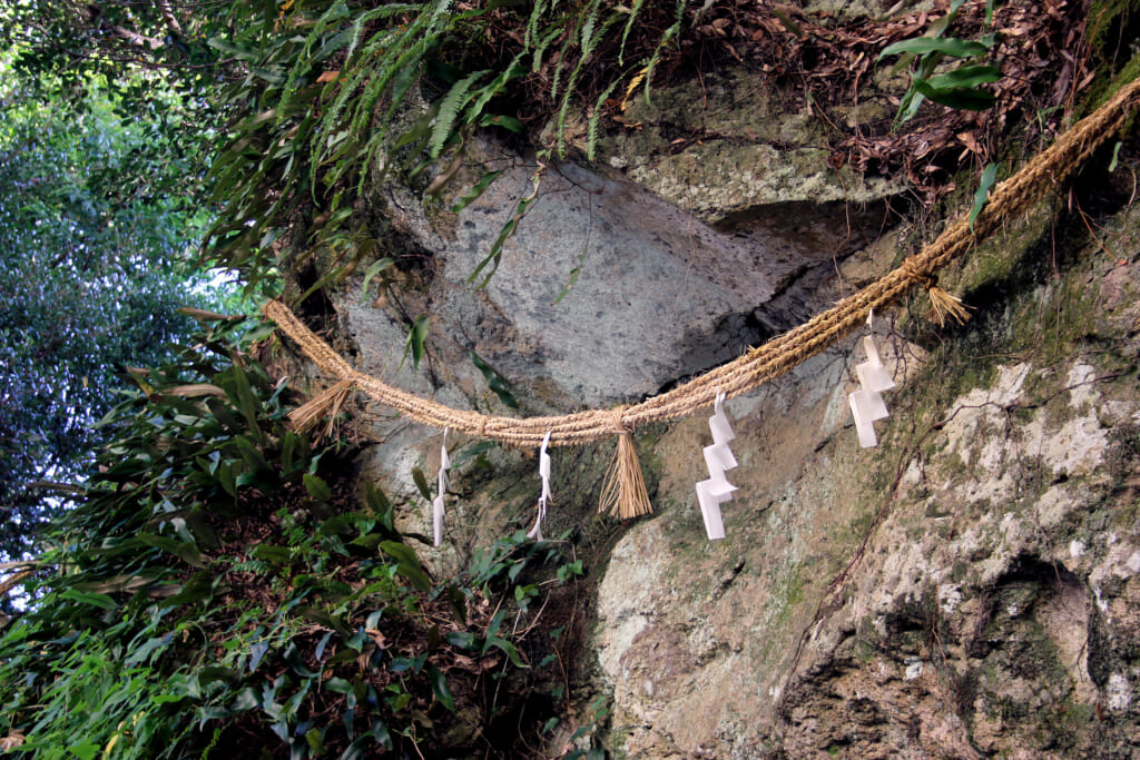 a hemp rope is attached around the rock on the Kumano Kodo