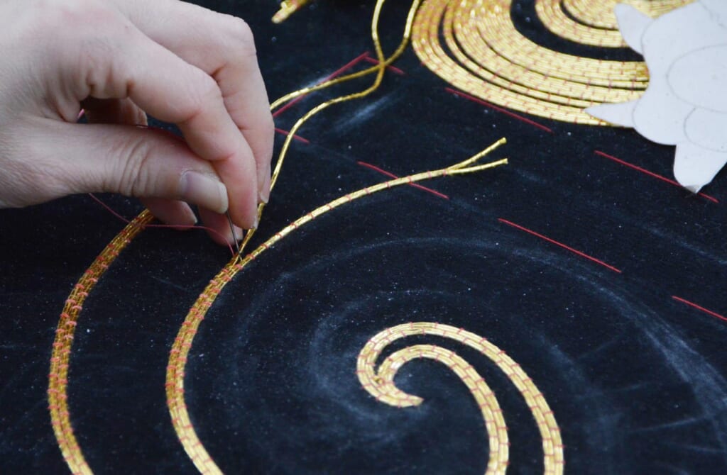 Embroidery of golden threads on Japanese theater costume