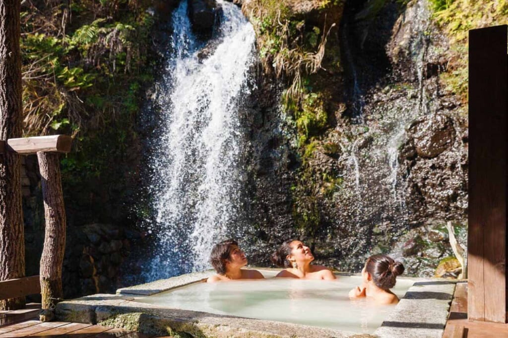 people relaxing in a Japanese onsen hot spring in Beppu, Japan