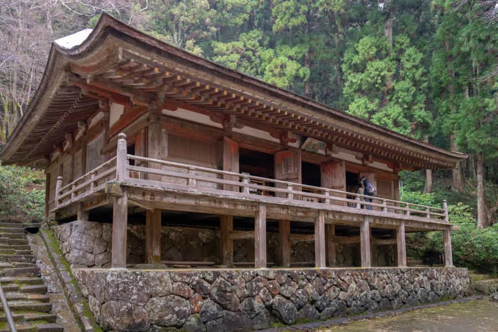 wooden japanese building with stone base in japan