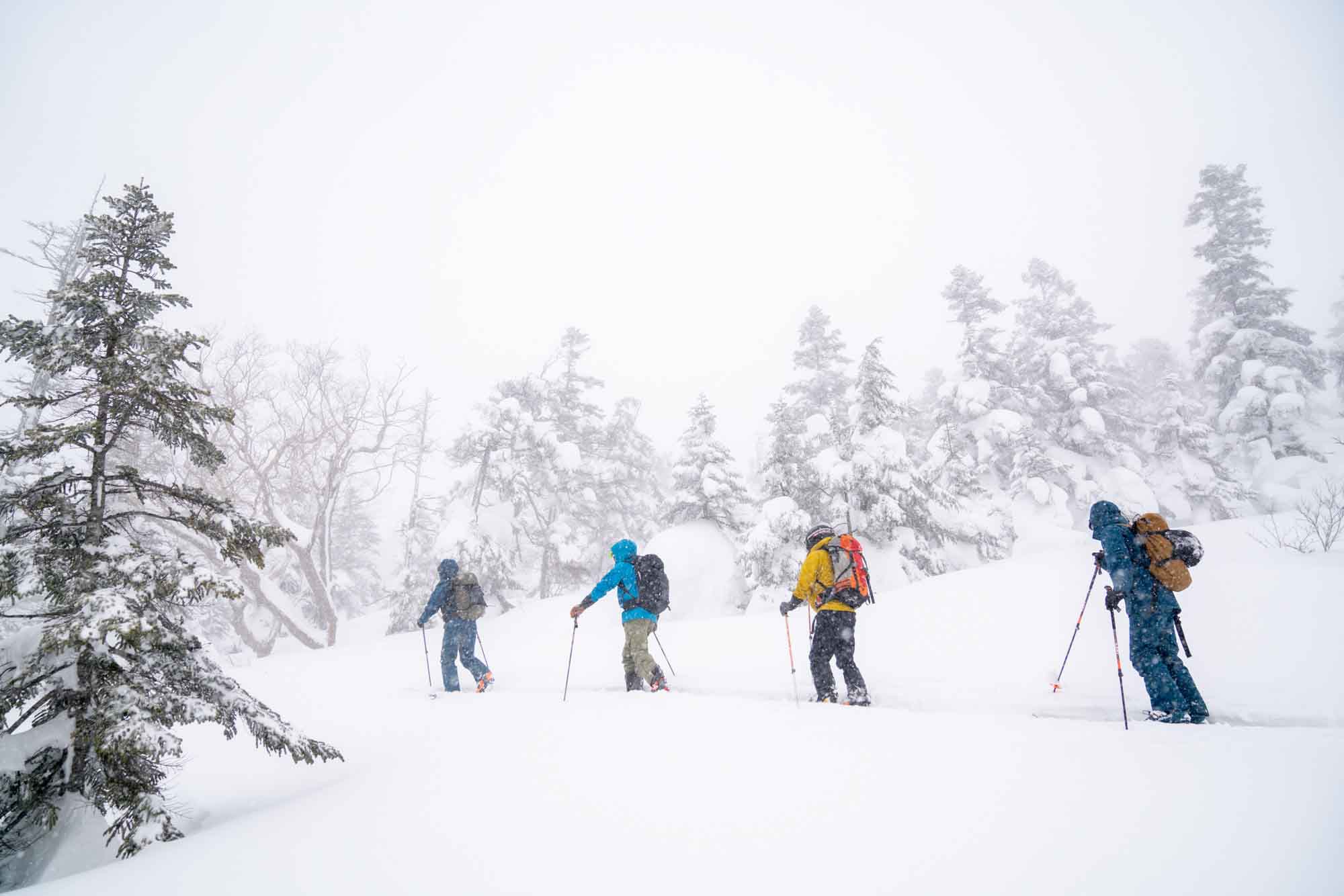 Ascending to the peak of Mt. Hachimantai  while spring skiing in Japan