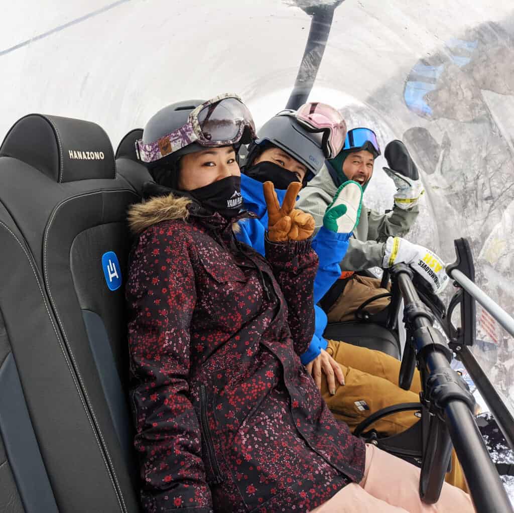 Skiers and Snowboarders on the new Hanazono 6-seater lift
