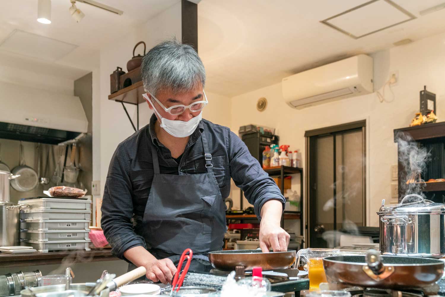 man cooking  in Chagohan Tokyo, Japan