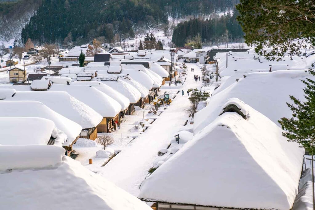 Ouchijuku snowy street lined with thatched-roof houses