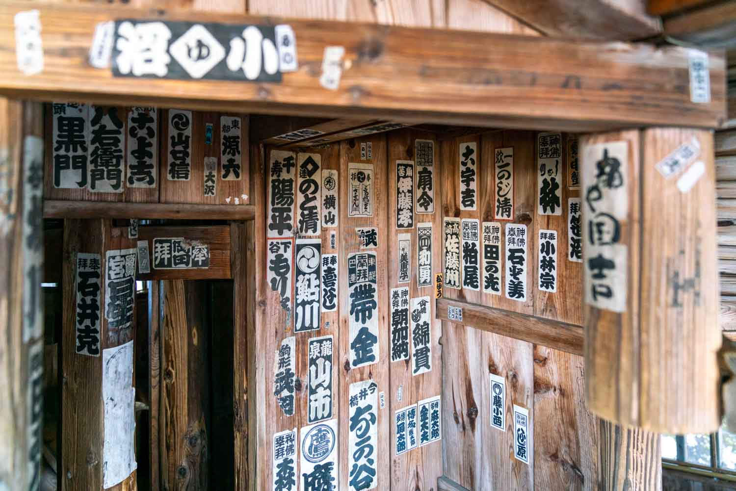 stickers inside Sazaedo Temple on Mt Iimoriyama